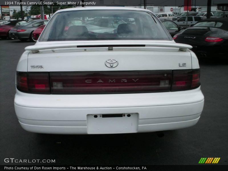 Super White / Burgundy 1994 Toyota Camry LE Sedan