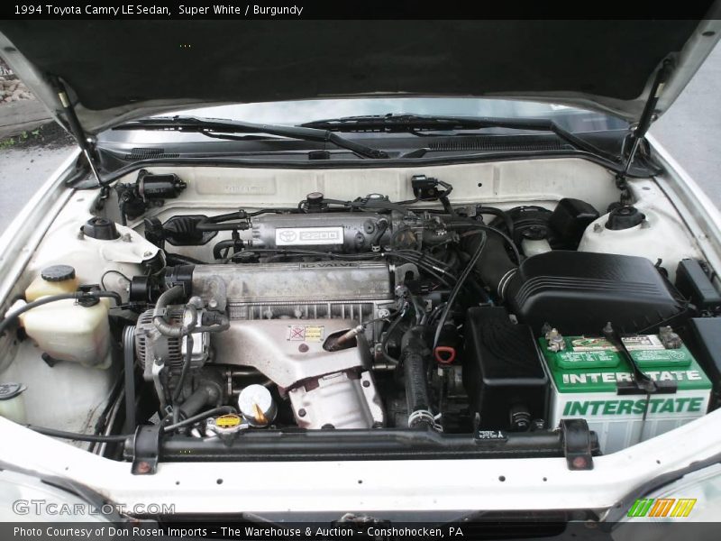 Super White / Burgundy 1994 Toyota Camry LE Sedan