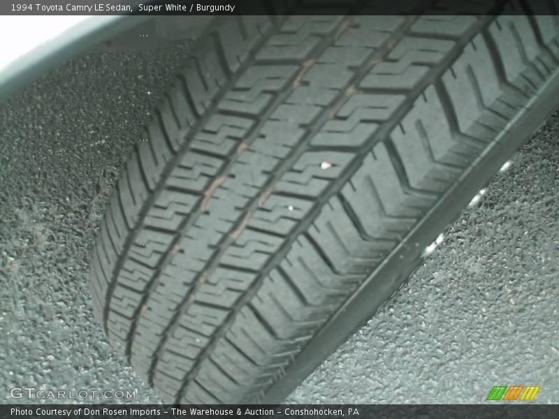 Super White / Burgundy 1994 Toyota Camry LE Sedan