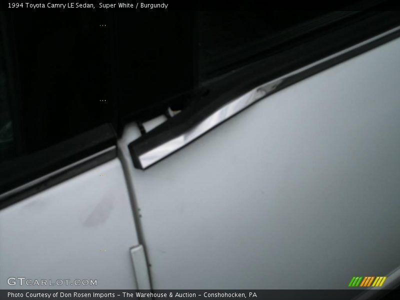 Super White / Burgundy 1994 Toyota Camry LE Sedan