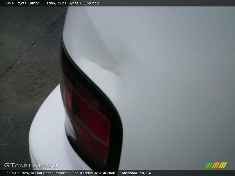 Super White / Burgundy 1994 Toyota Camry LE Sedan