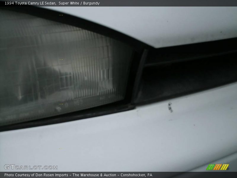 Super White / Burgundy 1994 Toyota Camry LE Sedan
