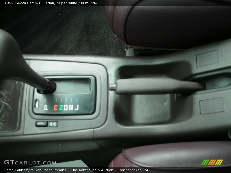 Super White / Burgundy 1994 Toyota Camry LE Sedan