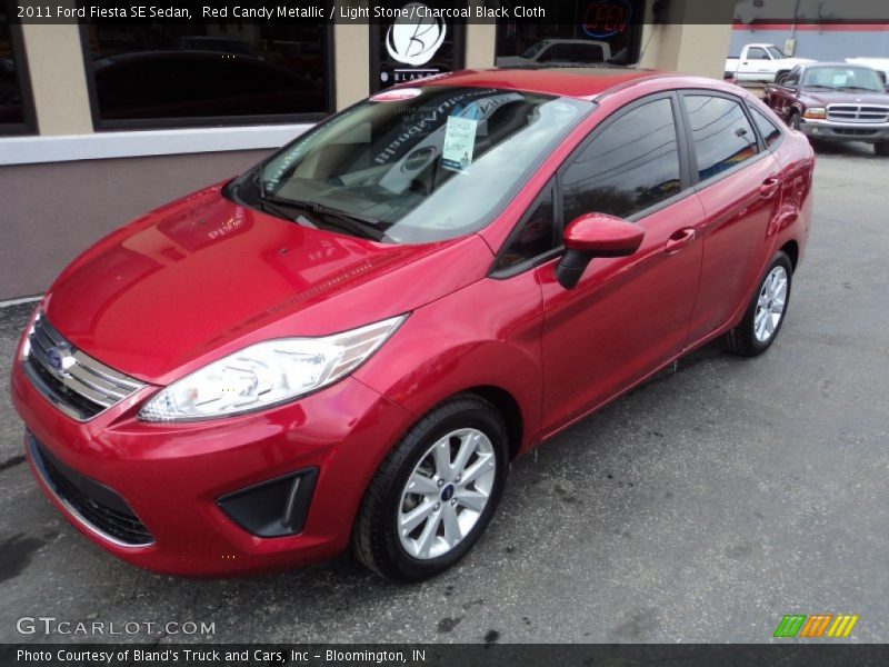 Red Candy Metallic / Light Stone/Charcoal Black Cloth 2011 Ford Fiesta SE Sedan