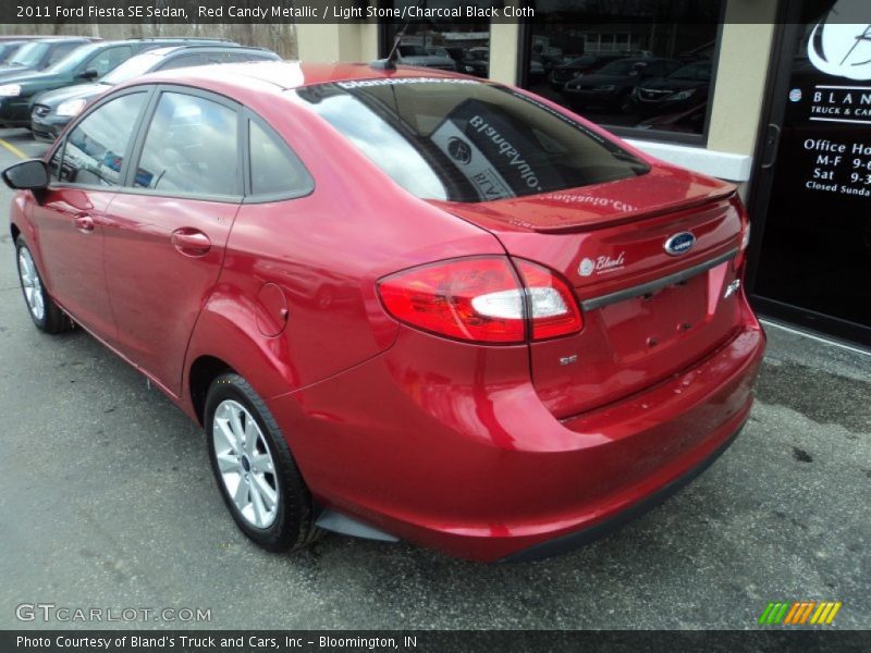 Red Candy Metallic / Light Stone/Charcoal Black Cloth 2011 Ford Fiesta SE Sedan