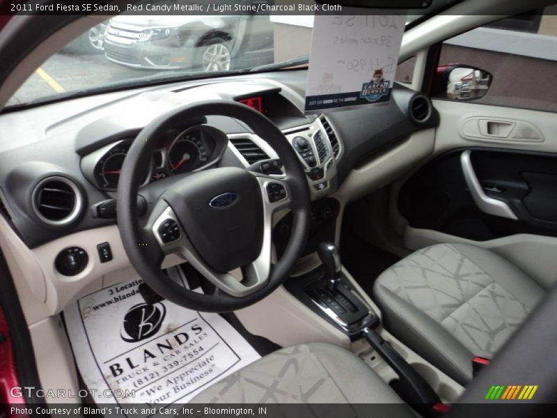 Red Candy Metallic / Light Stone/Charcoal Black Cloth 2011 Ford Fiesta SE Sedan