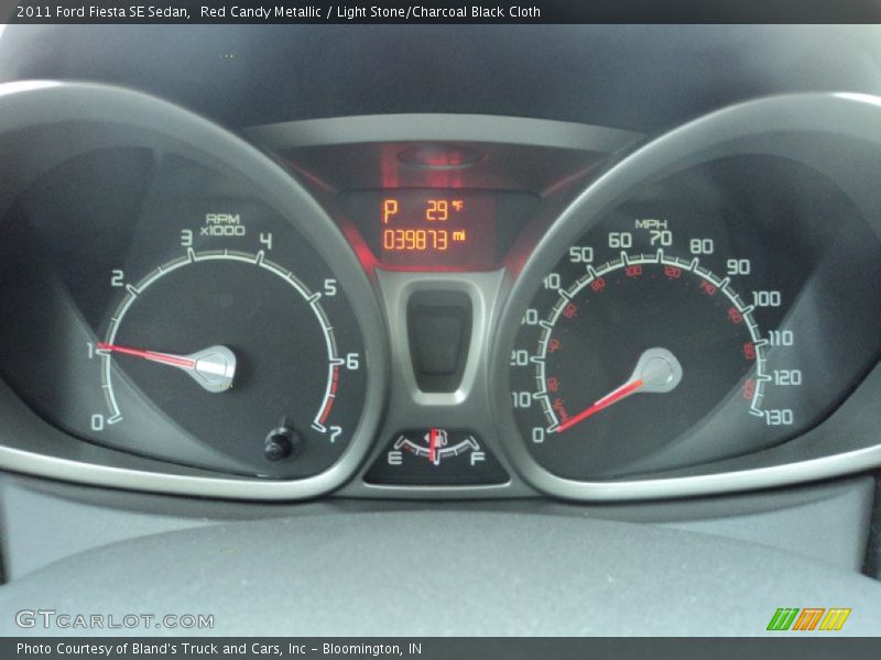 Red Candy Metallic / Light Stone/Charcoal Black Cloth 2011 Ford Fiesta SE Sedan