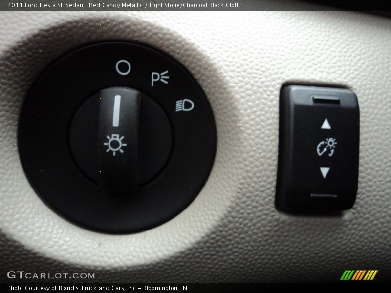 Red Candy Metallic / Light Stone/Charcoal Black Cloth 2011 Ford Fiesta SE Sedan