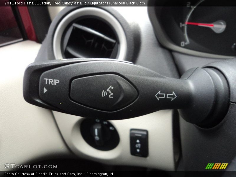 Red Candy Metallic / Light Stone/Charcoal Black Cloth 2011 Ford Fiesta SE Sedan