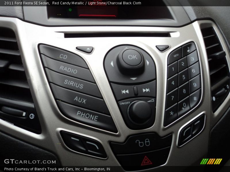 Red Candy Metallic / Light Stone/Charcoal Black Cloth 2011 Ford Fiesta SE Sedan