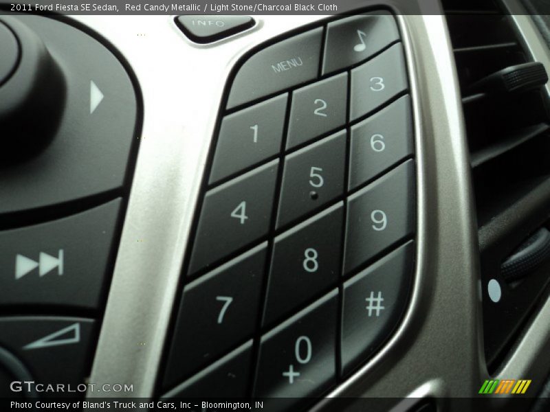 Red Candy Metallic / Light Stone/Charcoal Black Cloth 2011 Ford Fiesta SE Sedan