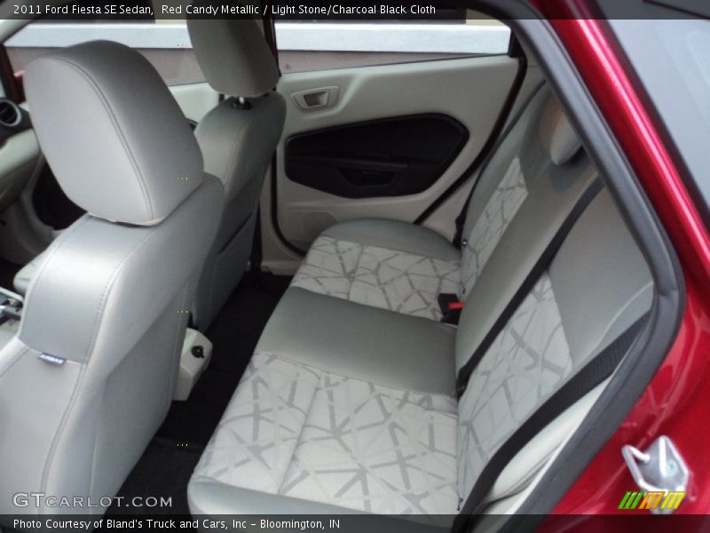 Red Candy Metallic / Light Stone/Charcoal Black Cloth 2011 Ford Fiesta SE Sedan