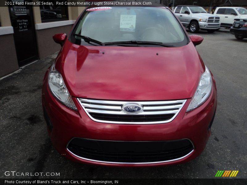 Red Candy Metallic / Light Stone/Charcoal Black Cloth 2011 Ford Fiesta SE Sedan