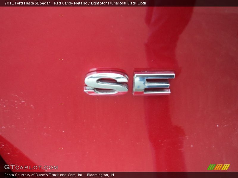Red Candy Metallic / Light Stone/Charcoal Black Cloth 2011 Ford Fiesta SE Sedan