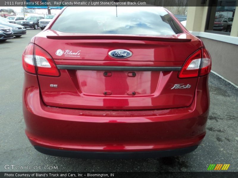 Red Candy Metallic / Light Stone/Charcoal Black Cloth 2011 Ford Fiesta SE Sedan