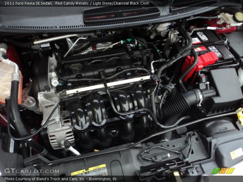 Red Candy Metallic / Light Stone/Charcoal Black Cloth 2011 Ford Fiesta SE Sedan