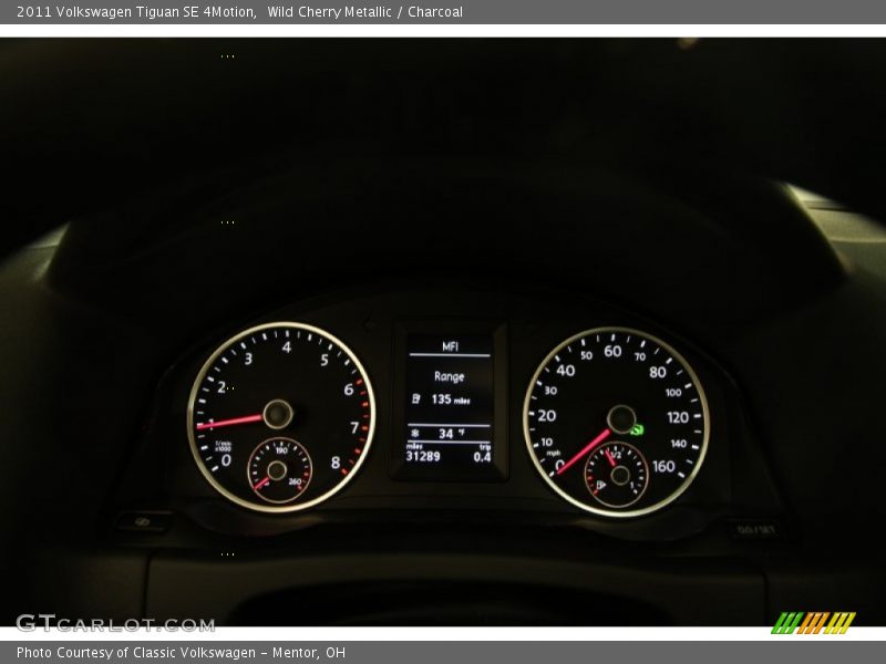Wild Cherry Metallic / Charcoal 2011 Volkswagen Tiguan SE 4Motion