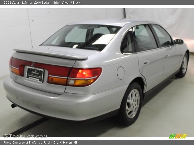 Bright Silver / Black 2002 Saturn L Series L200 Sedan