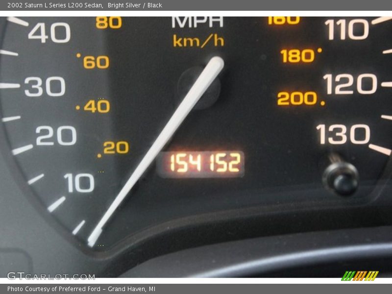 Bright Silver / Black 2002 Saturn L Series L200 Sedan