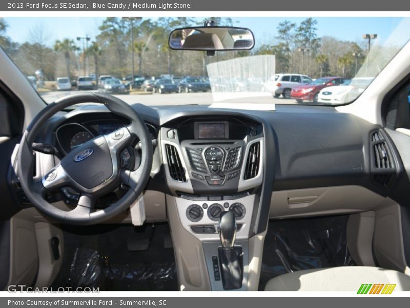 Blue Candy / Medium Light Stone 2013 Ford Focus SE Sedan