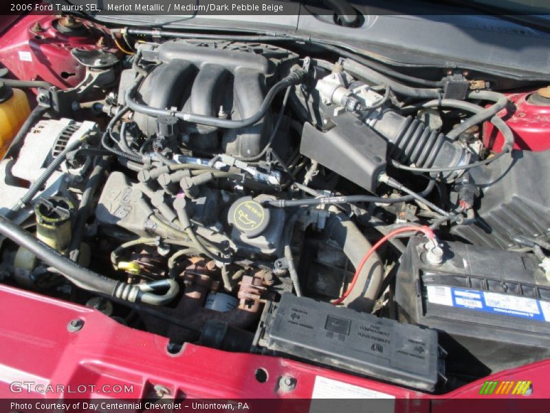 Merlot Metallic / Medium/Dark Pebble Beige 2006 Ford Taurus SEL