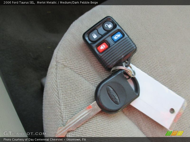 Merlot Metallic / Medium/Dark Pebble Beige 2006 Ford Taurus SEL