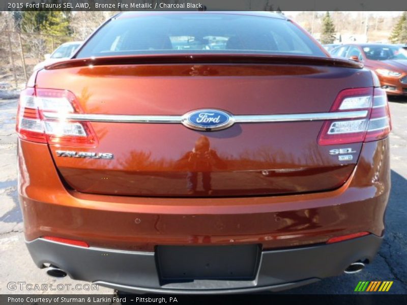 Bronze Fire Metallic / Charcoal Black 2015 Ford Taurus SEL AWD