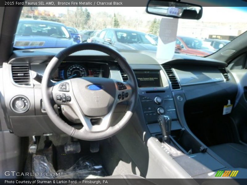 Bronze Fire Metallic / Charcoal Black 2015 Ford Taurus SEL AWD