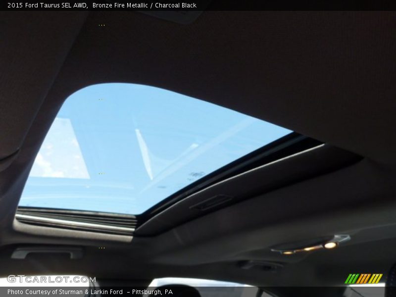 Bronze Fire Metallic / Charcoal Black 2015 Ford Taurus SEL AWD