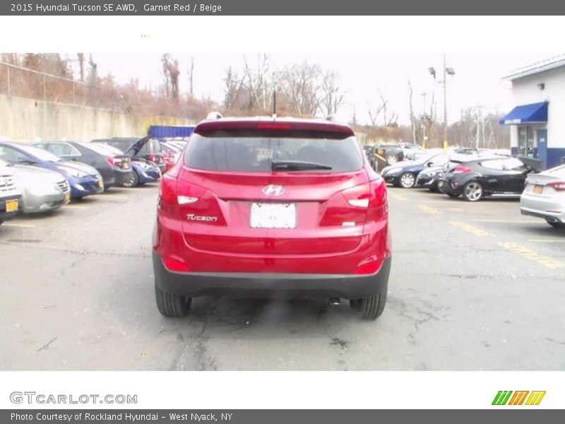 Garnet Red / Beige 2015 Hyundai Tucson SE AWD