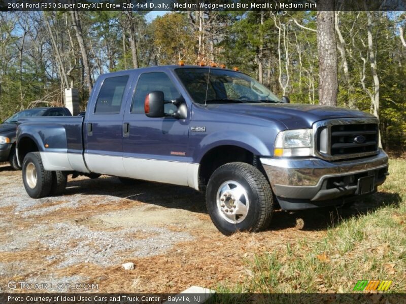 Front 3/4 View of 2004 F350 Super Duty XLT Crew Cab 4x4 Dually