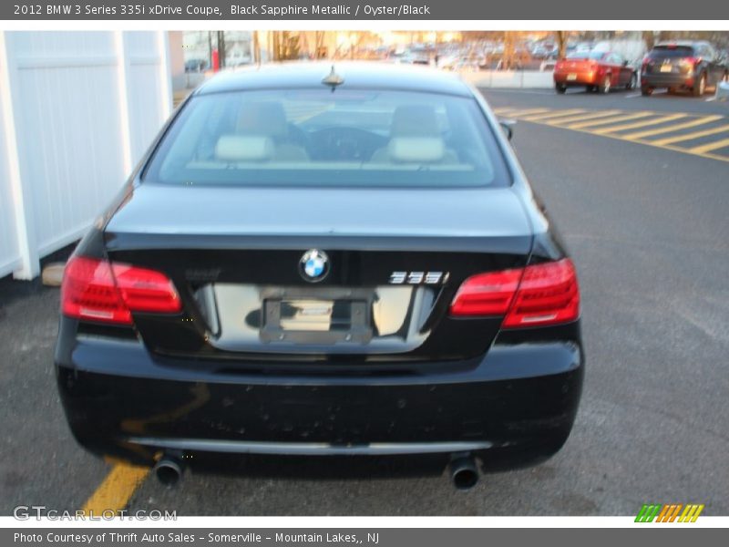 Black Sapphire Metallic / Oyster/Black 2012 BMW 3 Series 335i xDrive Coupe