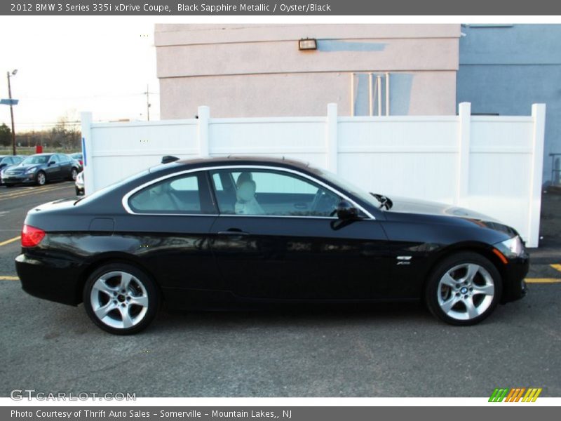 Black Sapphire Metallic / Oyster/Black 2012 BMW 3 Series 335i xDrive Coupe