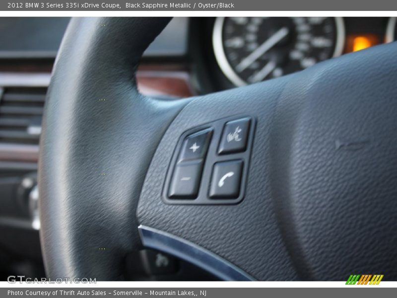 Black Sapphire Metallic / Oyster/Black 2012 BMW 3 Series 335i xDrive Coupe