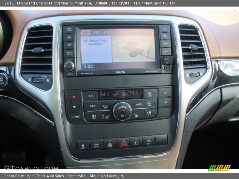 Brilliant Black Crystal Pearl / New Saddle/Black 2011 Jeep Grand Cherokee Overland Summit 4x4