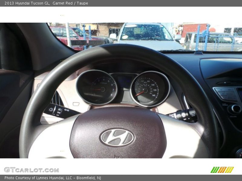 Garnet Red / Taupe 2013 Hyundai Tucson GL