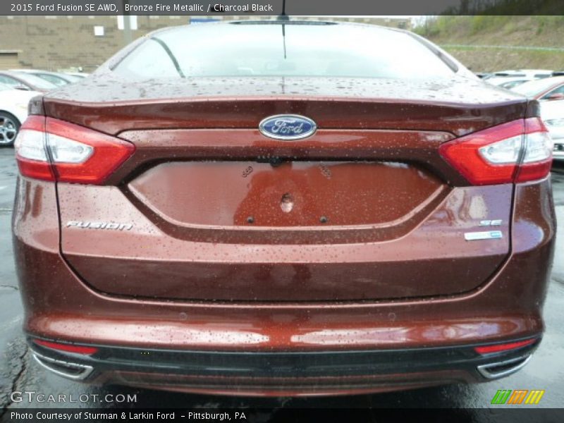 Bronze Fire Metallic / Charcoal Black 2015 Ford Fusion SE AWD
