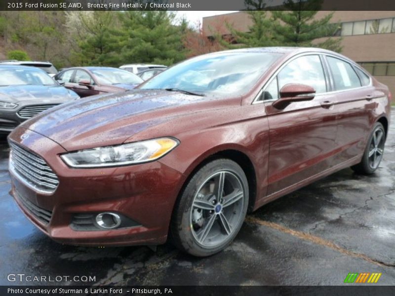 Bronze Fire Metallic / Charcoal Black 2015 Ford Fusion SE AWD