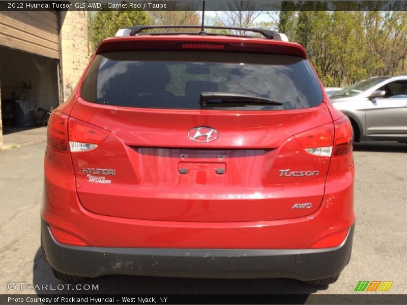 Garnet Red / Taupe 2012 Hyundai Tucson GLS AWD