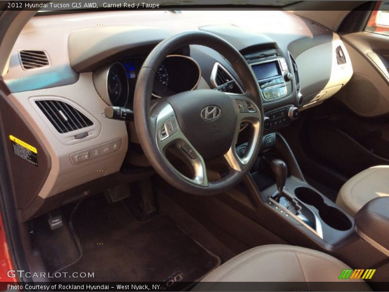 Garnet Red / Taupe 2012 Hyundai Tucson GLS AWD