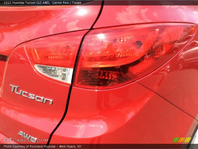 Garnet Red / Taupe 2012 Hyundai Tucson GLS AWD