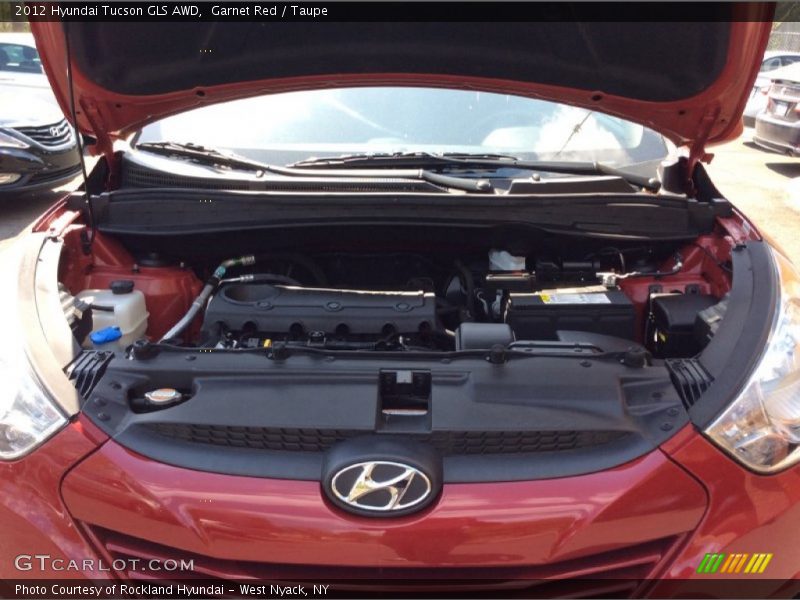 Garnet Red / Taupe 2012 Hyundai Tucson GLS AWD
