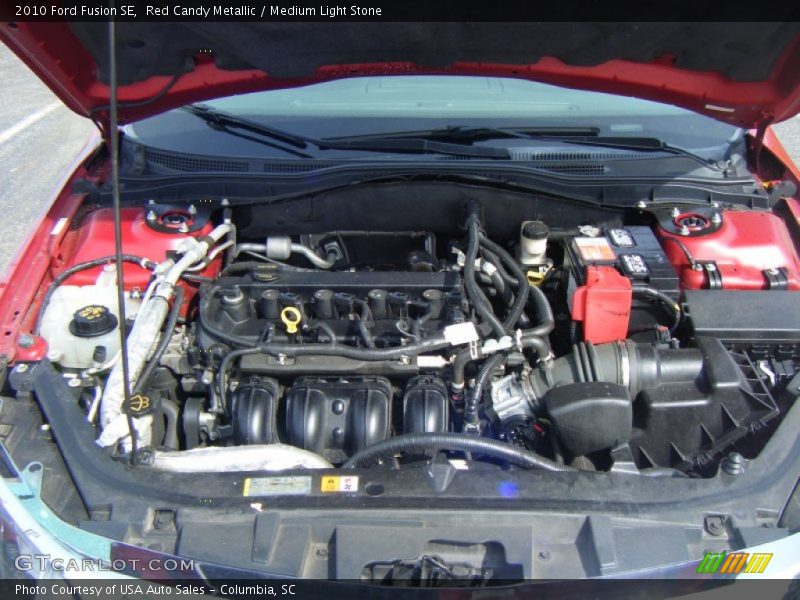 Red Candy Metallic / Medium Light Stone 2010 Ford Fusion SE