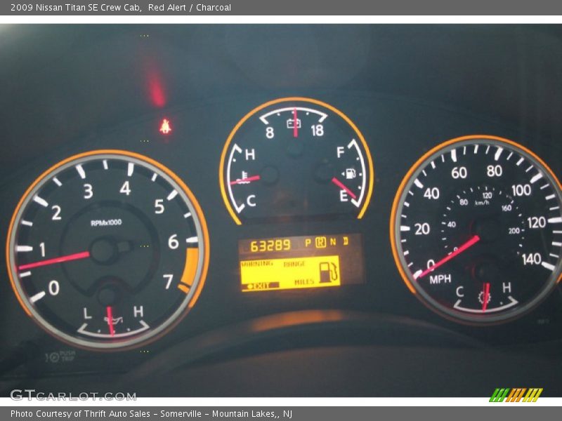 Red Alert / Charcoal 2009 Nissan Titan SE Crew Cab