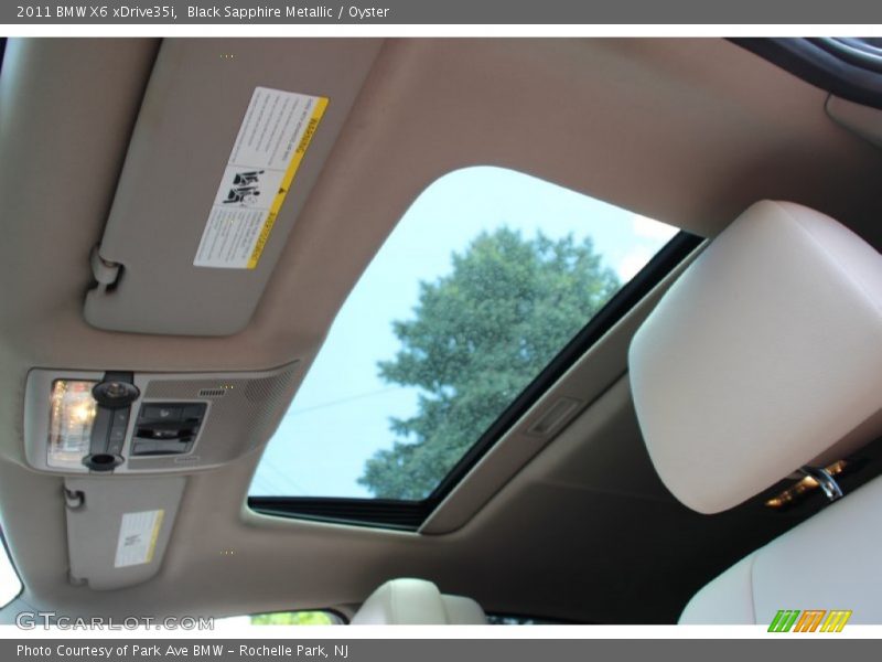 Black Sapphire Metallic / Oyster 2011 BMW X6 xDrive35i