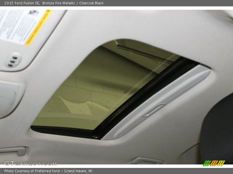 Bronze Fire Metallic / Charcoal Black 2015 Ford Fusion SE