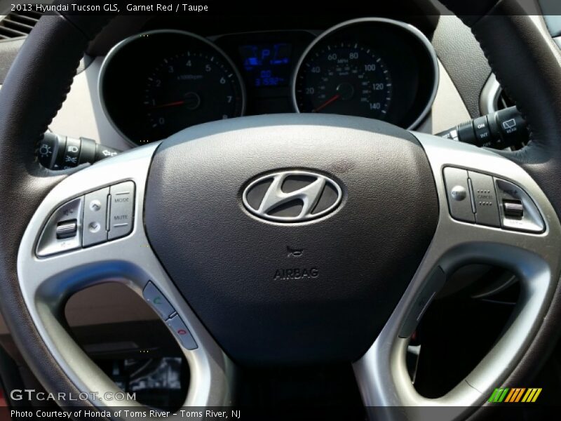 Garnet Red / Taupe 2013 Hyundai Tucson GLS