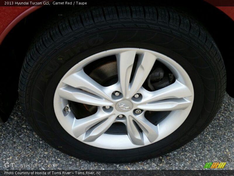 Garnet Red / Taupe 2013 Hyundai Tucson GLS