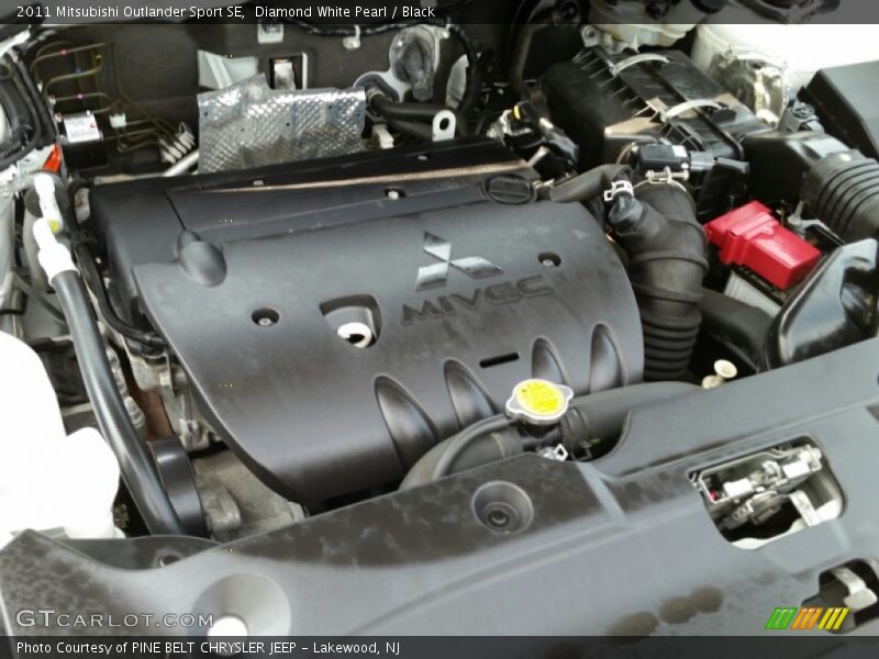 Diamond White Pearl / Black 2011 Mitsubishi Outlander Sport SE