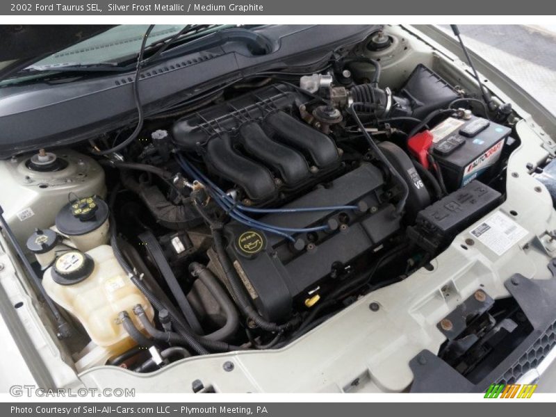 Silver Frost Metallic / Medium Graphite 2002 Ford Taurus SEL